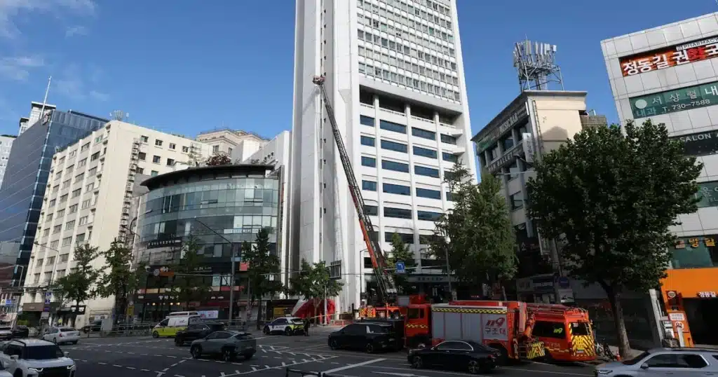 Union Official Hangs from Building in Protest Over Alleged Unfair Dismissal Union Official Hangs from Building in Protest Over Alleged Unfair Dismissal