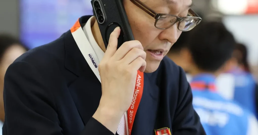 North Korean Delegation Sports Kim Dynasty Badges, Samsung Phones at Asian Games North Korean Delegation Sports Kim Dynasty Badges, Samsung Phones at Asian Games
